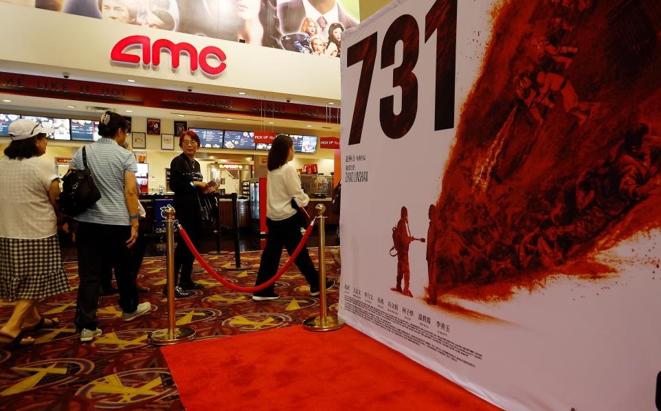 People enter a movie theater to attend the Los Angeles premiere of the film Evil Unbound in Los Angeles, the United States, Sept. 18, 2025..jpg